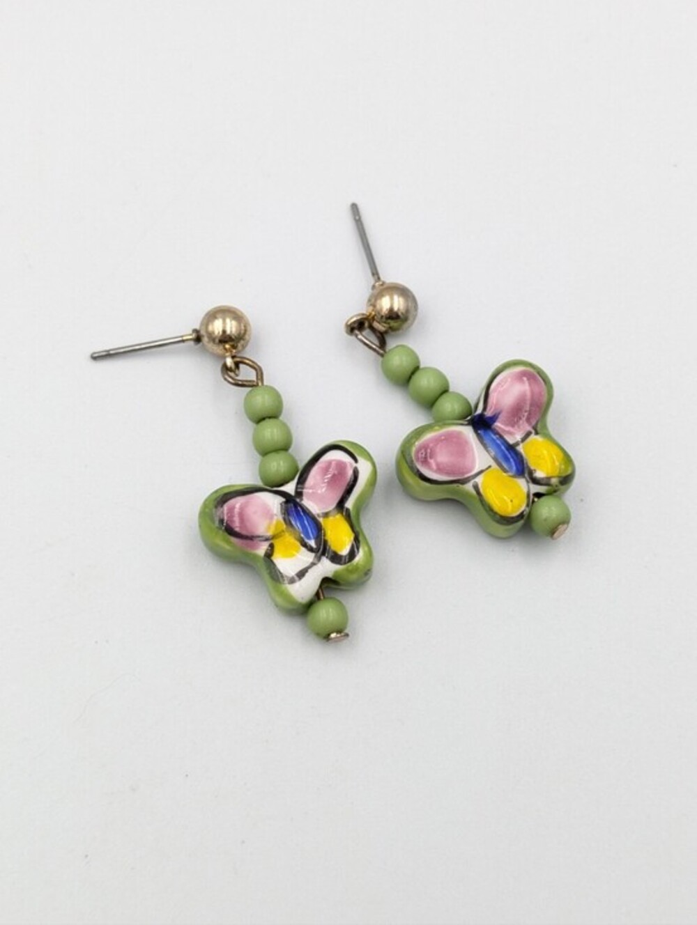 Green hand painted ceramic butterfly dangle earrings